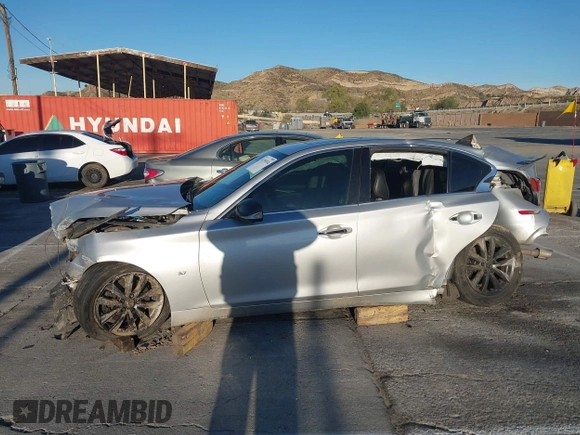 2015 Infiniti Q50 z VIN JN1BV7AP4FM341453, wystawiony jako IAAI lot #41755534 z przebiegiem Nie podano mil oraz . Historia ofert i sprzedaży dostępna na DreamBid. Obrazek 14.