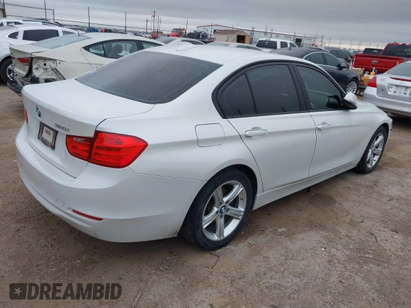 2015 BMW 3 Series 320i with VIN WBA3B1C5XFK140734, listed as a IAAI auction lot 42141319 with 84,863 mi miles and . Bid and sale history available at DreamBid. Image 4.