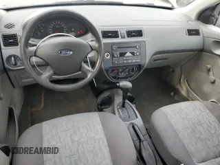 2005 Ford Focus S with VIN 1FAFP34N55W115653, listed as a Copart auction lot 63043315 with 110,593 mi miles and Salvage title. Bid and sale history available at DreamBid. Image 8.