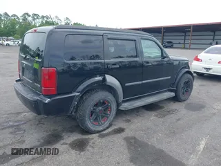 2007 Dodge Nitro SXT with VIN 1D8GT28K17W605984, listed as a IAAI auction lot 41970841 with 118,700 mi miles. Bid and sale history available at carsss.com. Image 4.