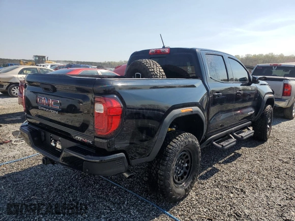 2024 GMC Canyon 4WD AT4X with VIN 1GTP6EEK7R1222174, listed as a Copart auction lot 50627415 with 2,642 mi miles and Salvage Title. Bid and sale history available at carsss.com. Image 3.