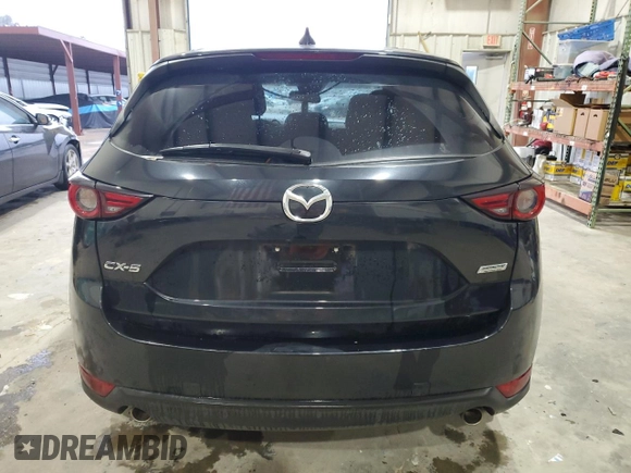 2018 Mazda CX-5 Grand Touring with VIN JM3KFADM3J0325843, listed as a Copart auction lot 87958375 with 93,577 mi miles and Salvage title. Bid and sale history available at DreamBid. Image 6.