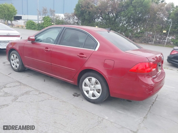 2009 Kia Optima LX with VIN KNAGE228095312766, listed as a IAAI auction lot 42074522 with 183,240 mi miles. Bid and sale history available at carsss.com. Image 3.