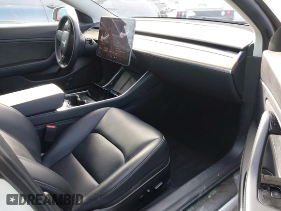 2020 Tesla Model 3 Long Range with VIN 5YJ3E1EB9LF620771, listed as a IAAI auction lot 41795008 with 53,155 mi miles and . Bid and sale history available at DreamBid. Image 5.