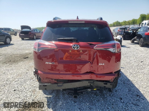 2018 Toyota RAV4 XLE with VIN JTMWFREV7JD119143, listed as a Copart auction lot 52576915 with 56,947 mi miles and Salvage Title. Bid and sale history available at carsss.com. Image 6.