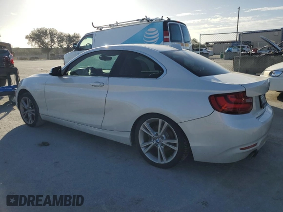 2015 BMW 2 Series 228i with VIN WBA1F5C59FV257321, listed as a Copart auction lot 80915464 with 113,776 mi miles and Salvage title. Bid and sale history available at DreamBid. Image 2.