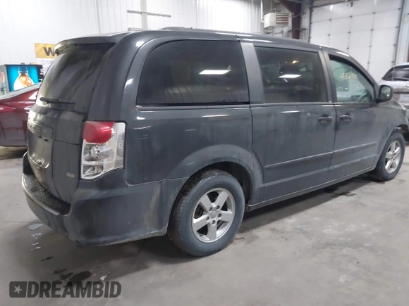 2012 Dodge Grand Caravan SXT with VIN 2C4RDGCG7CR358266, listed as a IAAI auction lot 41582428 with 169,137 mi miles and . Bid and sale history available at DreamBid. Image 4.