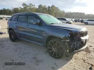 2020 Jeep Grand Cherokee Overland with VIN 1C4RJFCG8LC414033, listed as a Copart auction lot 87403024 with 55,111 mi miles and Salvage Title. Bid and sale history available at carsss.com. Image 4.