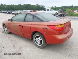 2002 Saturn SC z VIN 1G8ZR12742Z146956, wystawiony jako IAAI lot #42175290 z przebiegiem Nie podano mil oraz . Historia ofert i sprzedaży dostępna na DreamBid. Obrazek 3.