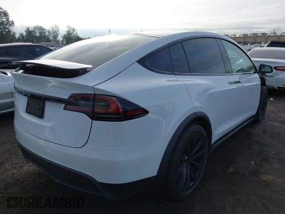 2023 Tesla Model X with VIN 7SAXCBE54PF384403, listed as a IAAI auction lot 40947187 with 16,881 mi miles and . Bid and sale history available at DreamBid. Image 4.