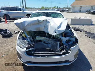 2020 Ford Fusion SE z VIN 3FA6P0LU8LR266686, wystawiony jako IAAI lot #41790126 z przebiegiem 95 314 mil mil oraz . Historia ofert i sprzedaży dostępna na DreamBid. Obrazek 12.