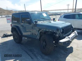 2024 Jeep Wrangler Sport S with VIN 1C4PJXAG9RW351435, listed as a IAAI auction lot 42429869 with 10,591 mi miles and . Bid and sale history available at DreamBid. Image 1.