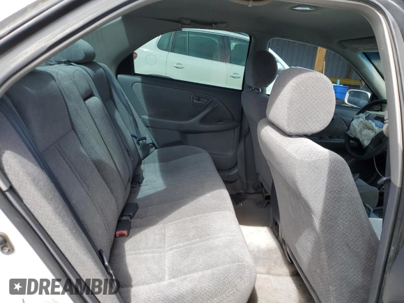 2000 Toyota Camry CE z VIN JT2BG22K2Y0479735, wystawiony jako Copart lot #50226755 z przebiegiem 282 694 mil mil oraz Nie do naprawy • Non repairable. Historia ofert i sprzedaży dostępna na DreamBid. Obrazek 11.