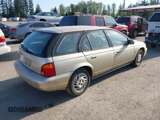1996 Saturn SW z VIN 1G8ZK8270TZ292057, wystawiony jako IAAI lot #42100826 z przebiegiem 207 561 mil mil oraz . Historia ofert i sprzedaży dostępna na DreamBid. Obrazek 4.