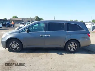 2012 Honda Odyssey EX-L with VIN 5FNRL5H6XCB061026, listed as a IAAI auction lot 42574612 with 144,480 mi miles and . Bid and sale history available at DreamBid. Image 14.