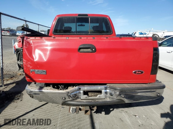 2004 Ford F-250 XL with VIN 1FTNX20P04EB98825, listed as a Copart auction lot 79729074 with 176,099 mi miles and Salvage title. Bid and sale history available at DreamBid. Image 6.