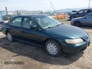2001 Honda Accord LX z VIN 1HGCG56431A037136, wystawiony jako IAAI lot #41950028 z przebiegiem 197 185 mil mil oraz . Historia ofert i sprzedaży dostępna na DreamBid. Obrazek 1.