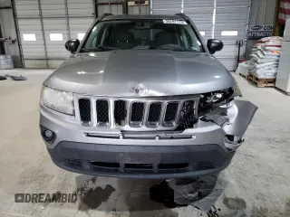 2016 Jeep Compass Sport with VIN 1C4NJCBA1GD512864, listed as a Copart auction lot 56297115 with 216,693 mi miles and Salvage title. Bid and sale history available at DreamBid. Image 5.