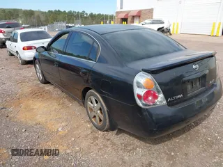 2003 Nissan Altima S with VIN 1N4AL11D03C165042, listed as a IAAI auction lot 41888473 with 306,629 mi miles. Bid and sale history available at carsss.com. Image 3.