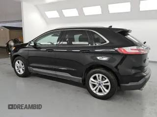 2020 Ford Edge SEL с VIN 2FMPK3J90LBA73990, выставлен на аукционе Copart как лот 61035945 с пробегом 113 511 миль миль и Чистый • Clean title. История ставок и продаж доступна на DreamBid. Изображение 2.