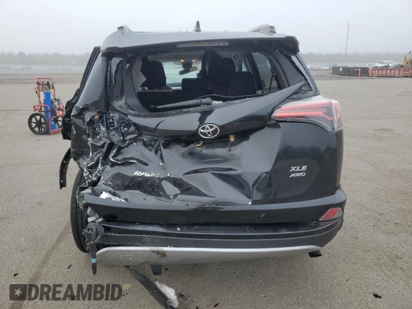 2018 Toyota RAV4 XLE with VIN 2T3RFREV8JW715099, listed as a Copart auction lot 51313485 with 140,107 mi miles and Salvage Title. Bid and sale history available at DreamBid. Image 6.