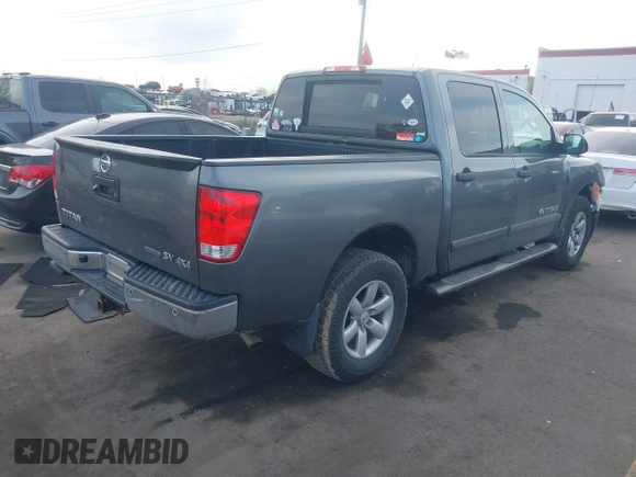 2014 Nissan Titan Pro-4X with VIN 1N6BA0EC3EN514358, listed as a IAAI auction lot 41636363 with 166,201 mi miles and . Bid and sale history available at DreamBid. Image 4.