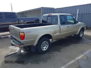 2002 Mazda B-Series 2WD Truck DS with VIN 4F4YR16U52TM18118, listed as a IAAI auction lot 41563022 with 126,136 mi miles. Bid and sale history available at carsss.com. Image 4.