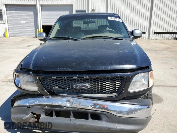 2003 Ford F-150 XLT with VIN 1FTRW07653KB60478, listed as a Copart auction lot 50491255 with 298,616 mi miles and Salvage Title. Bid and sale history available at carsss.com. Image 5.