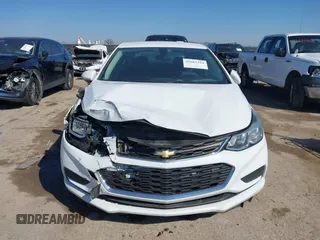2017 Chevrolet Cruze LS z VIN 1G1BC5SM5H7156009, wystawiony jako IAAI lot #41667324 z przebiegiem 164 754 mil mil oraz . Historia ofert i sprzedaży dostępna na DreamBid. Obrazek 12.