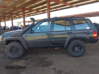 1994 Jeep Grand Cherokee Laredo with VIN 1J4GZ58S4RC280650, listed as a IAAI auction lot 42041261 with 199,265 mi miles and . Bid and sale history available at DreamBid. Image 14.