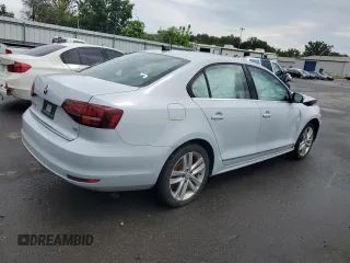 2017 Volkswagen Jetta SEL z VIN 3VWL17AJ6HM412147, wystawiony jako Copart lot #63333085 z przebiegiem Nie podano mil oraz Szkoda całkowita • Salvage title. Historia ofert i sprzedaży dostępna na DreamBid. Obrazek 3.