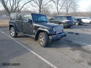 2016 Jeep Wrangler Unlimited Sahara with VIN 1C4HJWEGXGL186065, listed as a IAAI auction lot 41651599 with 127,435 mi miles. Bid and sale history available at carsss.com. Image 1.