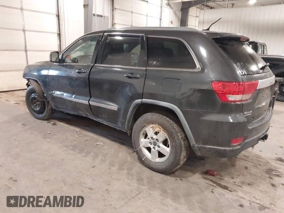2011 Jeep Grand Cherokee 70th Anniversary with VIN 1J4RR4GG3BC745652, listed as a IAAI auction lot 41133698 with 217,948 mi miles. Bid and sale history available at carsss.com. Image 3.