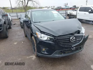 2016 Mazda CX-5 Touring with VIN JM3KE4CY1G0625916, listed as a IAAI auction lot 41971170 with 182,474 mi miles. Bid and sale history available at carsss.com. Image 1.