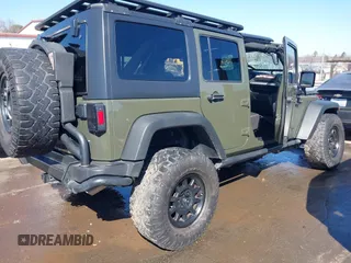 2015 Jeep Wrangler Unlimited Rubicon with VIN 1C4BJWFG0FL623431, listed as a IAAI auction lot 41651317 with 105,508 mi miles. Bid and sale history available at carsss.com. Image 4.