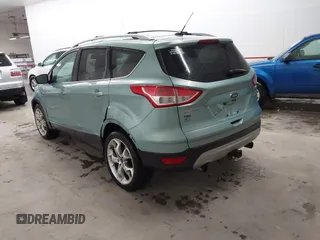 2013 Ford Escape Titanium with VIN 1FMCU9J9XDUC60029, listed as a IAAI auction lot 41936948 with 184,012 mi miles and . Bid and sale history available at DreamBid. Image 3.