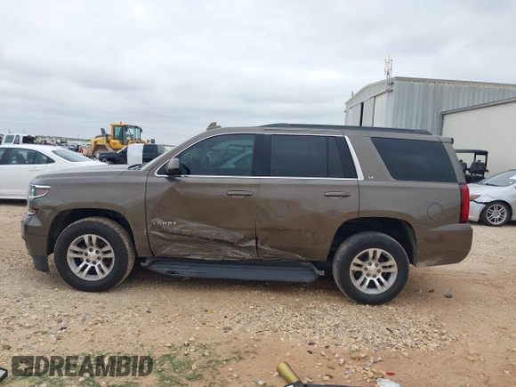 2015 Chevrolet Tahoe LT z VIN 1GNSCBKC2FR685780, wystawiony jako IAAI lot #42354130 z przebiegiem 101 617 mil mil oraz . Historia ofert i sprzedaży dostępna na DreamBid. Obrazek 14.