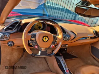 2016 Ferrari 488 z VIN ZFF79ALA5G0214993, wystawiony jako Copart lot #58869925 z przebiegiem 25 520 mil mil oraz Tytuł czysty. Historia ofert i sprzedaży dostępna na DreamBid. Obrazek 9.