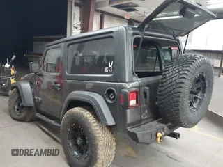 2020 Jeep Wrangler Sport S with VIN 1C4GJXAN4LW229040, listed as a IAAI auction lot 42172180 with 58,701 mi miles and . Bid and sale history available at DreamBid. Image 3.