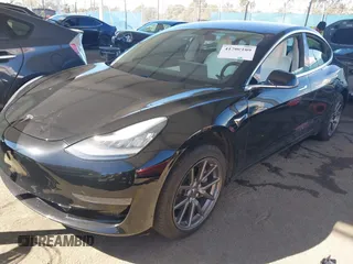 2020 Tesla Model 3 Standard Range Plus with VIN 5YJ3E1EA8LF661982, listed as a IAAI auction lot 41700109 with 30,271 mi miles and . Bid and sale history available at DreamBid. Image 2.