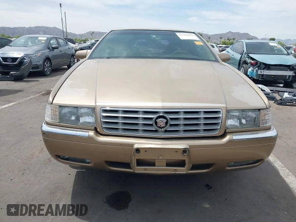 1999 Cadillac Eldorado ESC z VIN 1G6EL12Y5XU603764, wystawiony jako IAAI lot #42368692 z przebiegiem 154 613 mil mil oraz . Historia ofert i sprzedaży dostępna na DreamBid. Obrazek 6.
