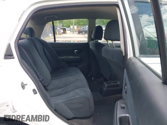 2010 Nissan Versa S with VIN 3N1BC1AP2AL409285, listed as a IAAI auction lot 42182721 with 266,855 mi miles and . Bid and sale history available at DreamBid. Image 8.