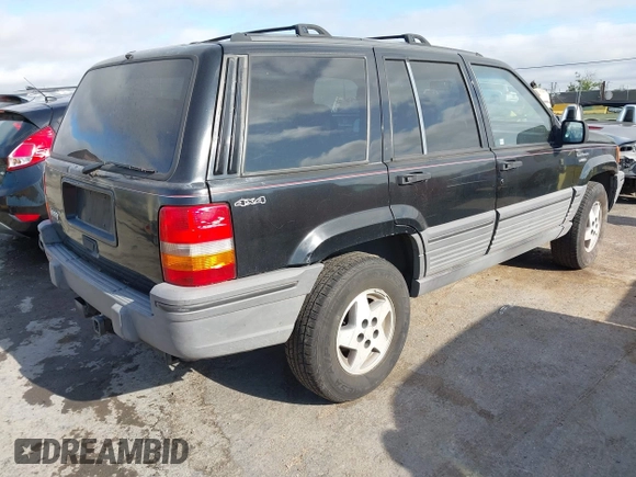 1995 Jeep Grand Cherokee Laredo z VIN 1J4GZ58S9SC553345, wystawiony jako IAAI lot #42772979 z przebiegiem 216 808 mil mil oraz . Historia ofert i sprzedaży dostępna na DreamBid. Obrazek 4.