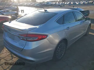 2017 Ford Fusion Hybrid Titanium with VIN 3FA6P0RU8HR190482, listed as a IAAI auction lot 41322244 with 137,539 mi miles and . Bid and sale history available at DreamBid. Image 4.