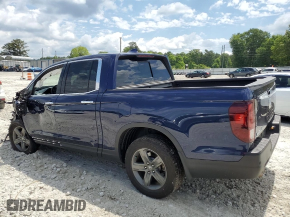 2023 Honda Ridgeline RTL-E with VIN 5FPYK3F74PB037333, listed as a Copart auction lot 56209715 with 36,041 mi miles and Salvage title. Bid and sale history available at DreamBid. Image 2.