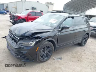 2023 Volkswagen Tiguan SE R-Line Black with VIN 3VVCB7AX0PM122636, listed as a IAAI auction lot 42040494 with 8,589 mi miles and . Bid and sale history available at DreamBid. Image 17.