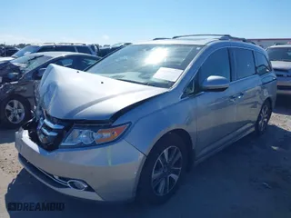 2016 Honda Odyssey Touring Elite with VIN 5FNRL5H91GB158499, listed as a IAAI auction lot 41899037 with 119,364 mi miles. Bid and sale history available at carsss.com. Image 2.