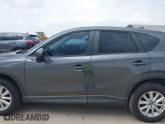 2016 Mazda CX-5 Sport with VIN JM3KE4BY8G0921243, listed as a IAAI auction lot 42102663 with 111,960 mi miles and . Bid and sale history available at DreamBid. Image 14.