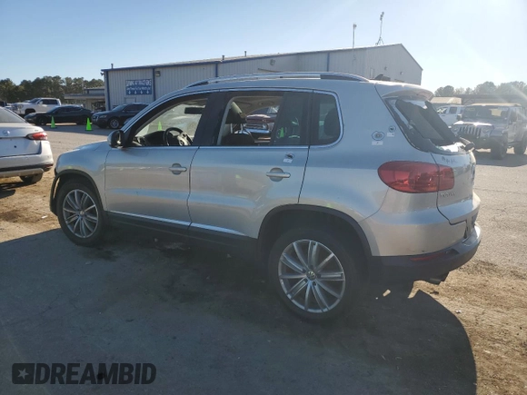 2014 Volkswagen Tiguan SE with VIN WVGAV3AX9EW611860, listed as a Copart auction lot 74431754 with 116,022 mi miles and Salvage title. Bid and sale history available at DreamBid. Image 2.