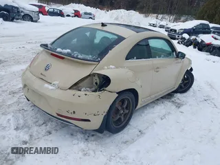 2019 Volkswagen Beetle S with VIN 3VWFD7AT1KM703684, listed as a IAAI auction lot 41571691 with 111,180 mi miles. Bid and sale history available at carsss.com. Image 4.